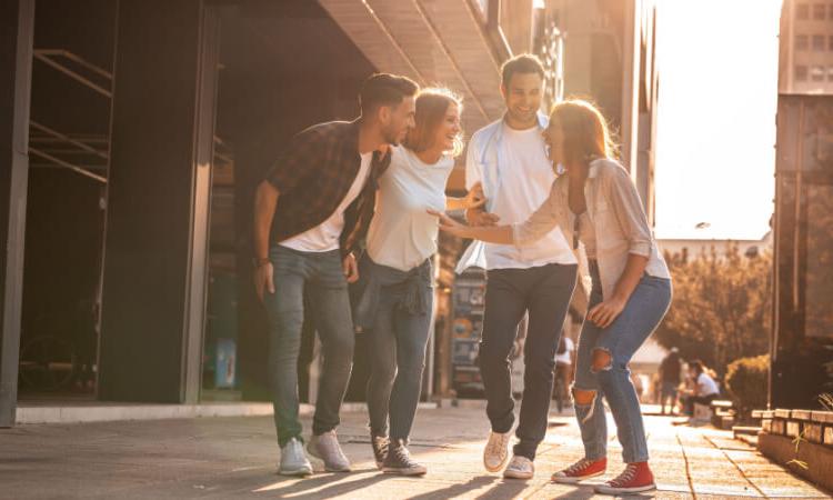 a group of friends chatting in a downtown area